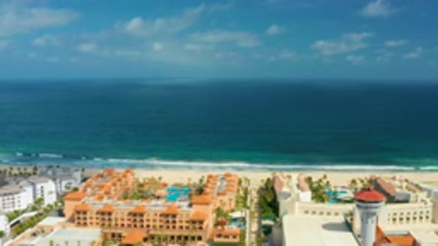 SAN JOSE DEL CABO MEXICO-2020: Lot Of Tall Buildings With Blue Sea Water Mild