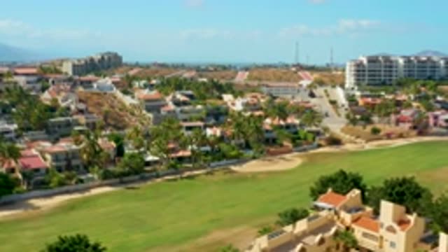 SAN JOSE DEL CABO MEXICO-2020: Houses In Front Of Grassy Field Seen From Above