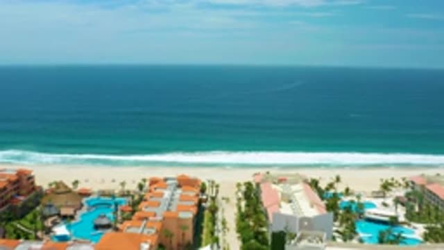 SAN JOSE DEL CABO MEXICO-2020: Beachfront Residences Lined With Palm Trees Look