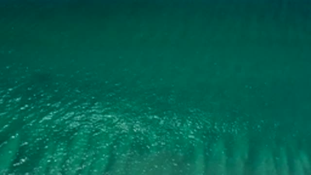 SAN JOSE DEL CABO MEXICO-2020: Bluish and Green Crystal Clear Sea Water Mild Waves