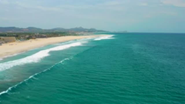SAN JOSE DEL CABO MEXICO-2020: Calm Ocean Waves Crashing On A Warm Sunny Beach
