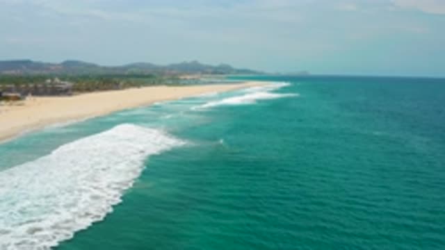 SAN JOSE DEL CABO MEXICO-2020: Waves Gently Lashing The Sandy Shores Of A Vacant