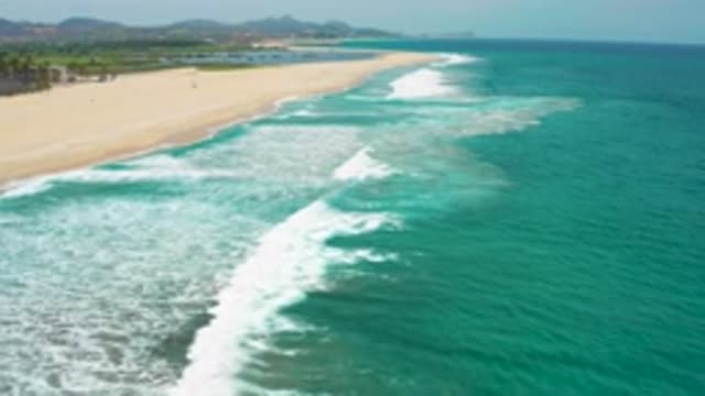 SAN JOSE DEL CABO MEXICO-2020: Gently Lashing The Sandy Shores Of A Vacant Beach