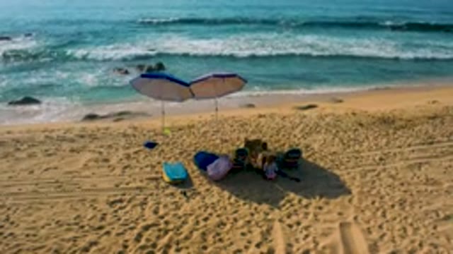 SHIPWRECKS BEACH BAJA CALIFORNIA SUR MEXICO-2020: Aerial View of Beach Umbrella and Gear