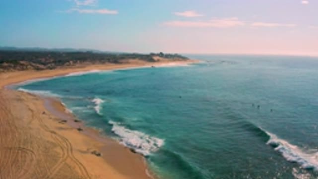 SHIPWRECKS BEACH BCS MEXICO-2020: Waves Bathing A Sandy Cove On A Sunny Day In