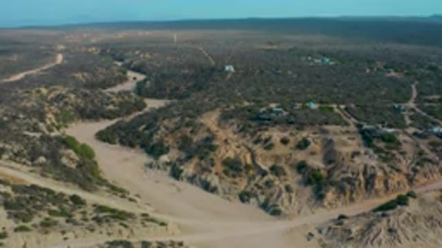 SHIPWRECKS BEACH BCS MEXICO-2020: Aerial Drone Shot Of A Dirt Path On A Rocky Mountain