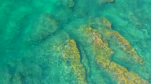 SHIPWRECKS BEACH BCS MEXICO-2020: Long Smooth Beige Rocks Visible Beneath