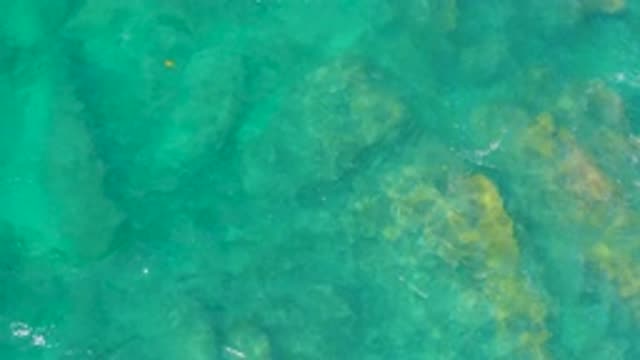 SHIPWRECKS BEACH BCS MEXICO-2020: Beige Rocks Submerged Beneath Clear Blue Water