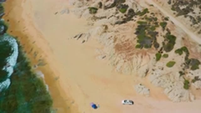 SHIPWRECKS BEACH BCS MEXICO-2020: Sky View Of Blue Waves Crashing Into Sandy And Rocky Shores
