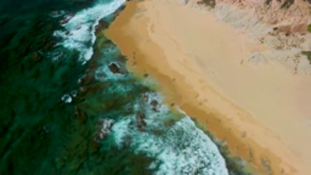 SHIPWRECKS BEACH BCS MEXICO-2020: Cyan Sea Frothy Waves Gently Lap Against Golden Shore