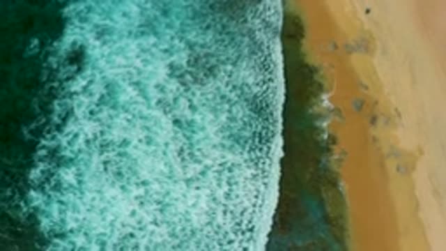 SHIPWRECKS BEACH BCS MEXICO-2020: Aerial View Of Green And Icy Waves Crashing On