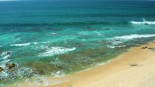 SHIPWRECKS BEACH BCS MEXICO-2020: Water Rushes Onto Sandy Beach In Calming Waves