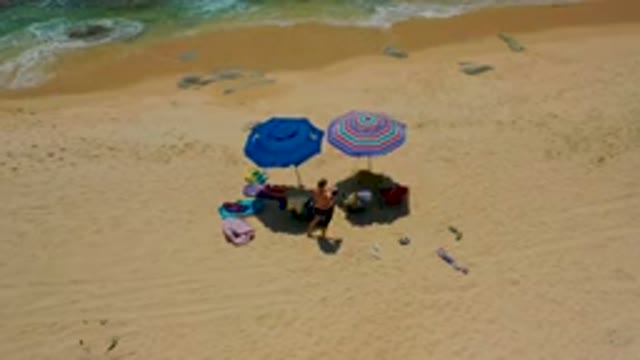 SHIPWRECKS BEACH BAJA CALIFORNIA SUR MEXICO-2020: Aerial View of Beach Umbrellas and People Relaxing