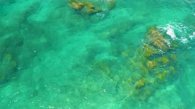 SHIPWRECKS BEACH BCS MEXICO-2020: Calming Water Moves Across Rocks Visible Below