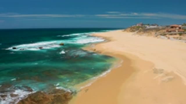 SHIPWRECKS BEACH BCS MEXICO-2020: Ocean Waves Crash Ashore On A Sandy Beach With