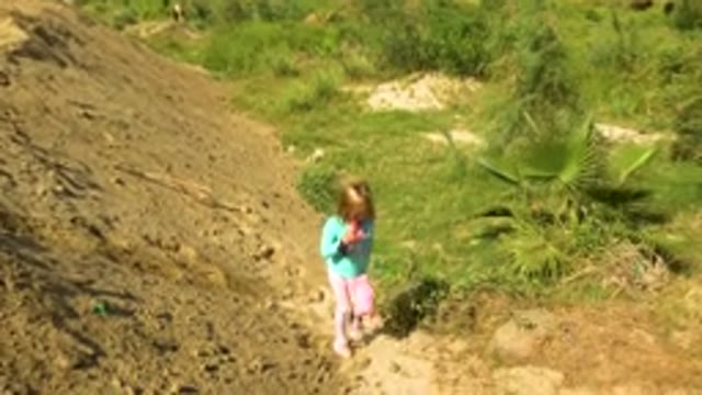Little Girl Walking Down Dirt Path