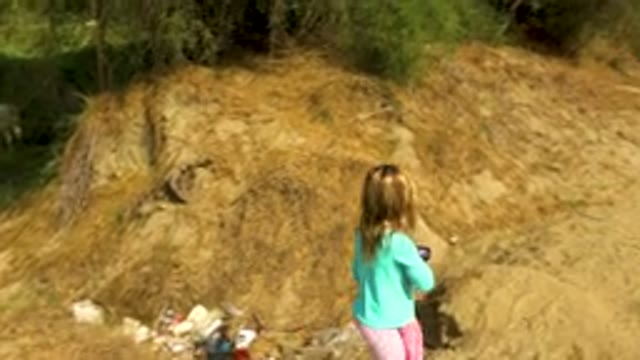 Little Girl Walking Along Dry Dirt Path
