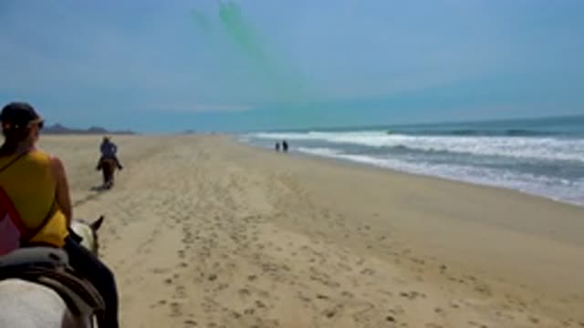 SAN JOSE DEL CABO MEXICO-2020: Two People Riding Horses On Beach With Two People