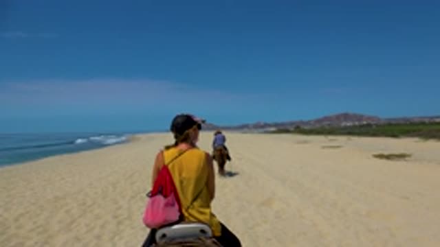 SAN JOSE DEL CABO MEXICO-2020: Girls Riding Two Camels