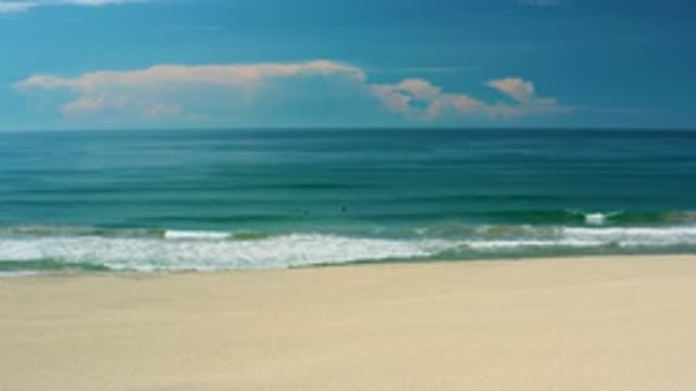 SAN JOSE DEL CABO MEXICO-2020: Gentle Ocean Waves Of Water Crash Into Beach On A