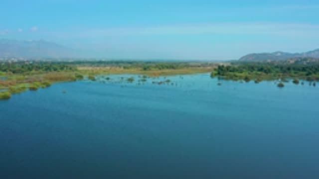 SAN JOSE DEL CABO MEXICO-2020: Calm Lakeside Waters With Blue Skies And Mountains
