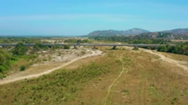 SAN JOSE DEL CABO MEXICO-2020: Child Running on Mud Road with Green Bushes