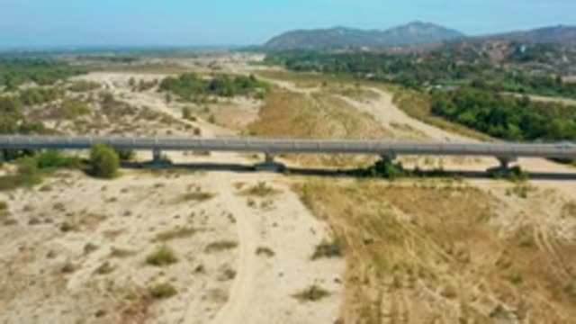 SAN JOSE DEL CABO MEXICO-2020: Long Strong Concrete Bridge White Car Running
