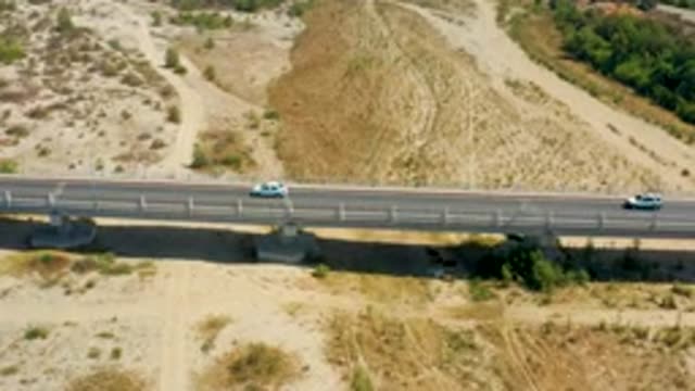SAN JOSE DEL CABO MEXICO-2020: Cars Traveling On A Bridge By The Countryside