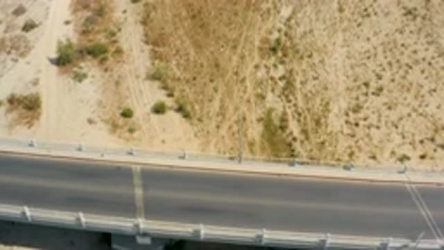 SAN JOSE DEL CABO MEXICO-2020: Strong Black Concrete Road Blue Car Running