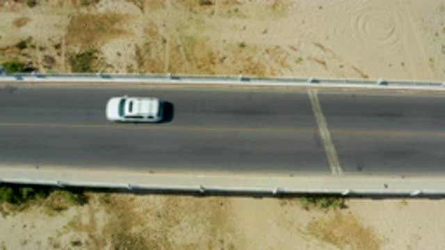 SAN JOSE DEL CABO MEXICO-2020: A Still Camera Taking Video Of Light Traffic On A
