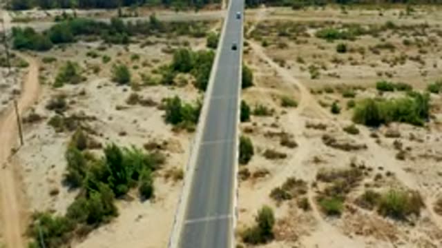 SAN JOSE DEL CABO MEXICO-2020: An Aerial View Of Vehicles Moving Along A Desert Highway