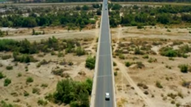 SAN JOSE DEL CABO MEXICO-2020: View Of A Desert Highway With A Single Car