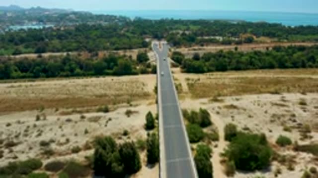 SAN JOSE DEL CABO MEXICO-2020: View From Above Of Cars Traveling Down Road In Desert