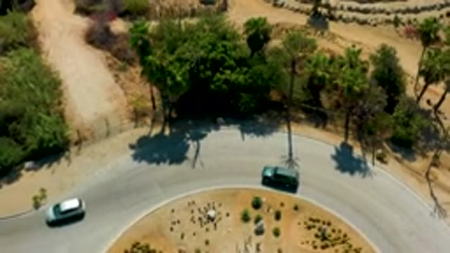 SAN JOSE DEL CABO MEXICO-2020: Large Compound With Trees And Plants With Trucks