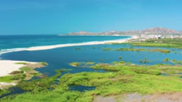 SAN JOSE DEL CABO MEXICO-2020: Blue Crystal Clear Sea With White Waves Hitting