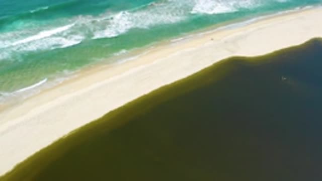 SAN JOSE DEL CABO MEXICO-2020: Clear Blue Waves Crashing Into Shore Opposite Of