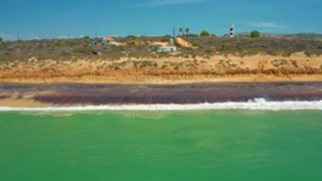 SAN JOSE DEL CABO MEXICO-2020: White Strong Waves Hitting The Rock Near The