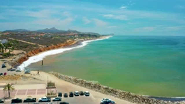 SAN JOSE DEL CABO MEXICO-2020: Luxury Cars Standing Near Blue Clear Beach