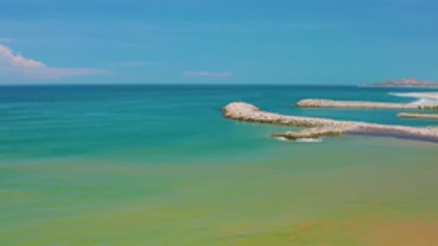 SAN JOSE DEL CABO MEXICO-2020: Green Blue Ocean Water Near Land With An Island