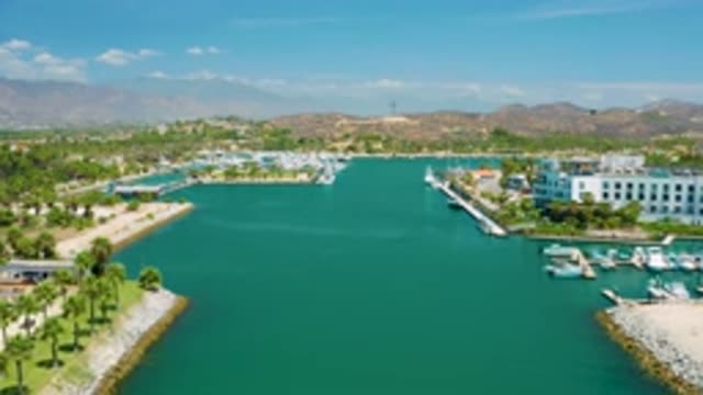 SAN JOSE DEL CABO MEXICO-2020: Lush Island With Vibrant Green Vegetation And Floating Plants