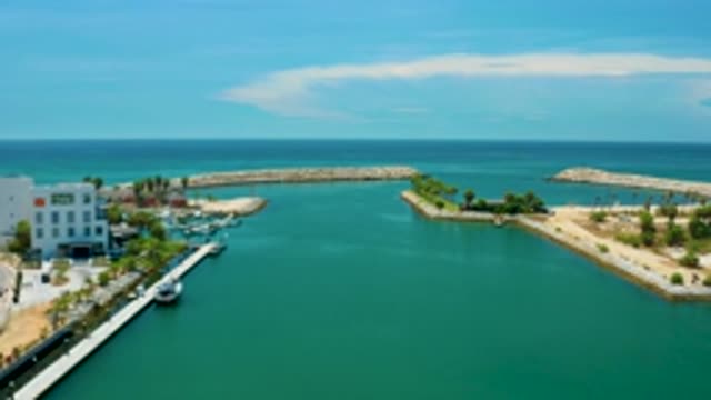 SAN JOSE DEL CABO MEXICO-2020: Beach-Side Resort With Palm Trees And Buildings