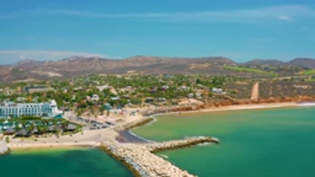 SAN JOSE DEL CABO MEXICO-2020: Green Blue Sea Water White Stone Arranged Tall