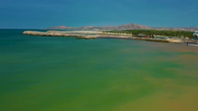 SAN JOSE DEL CABO MEXICO-2020: Flying Over Beautiful Green Sea To Coastline And