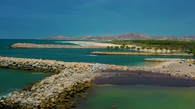 SAN JOSE DEL CABO MEXICO-2020: Low Sweeping Aerial View Of Rocky Breakers Near A