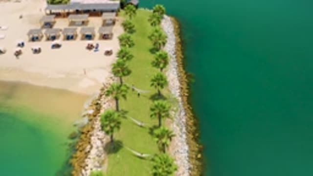 SAN JOSE DEL CABO MEXICO-2020: Blue Sea Water Tall Trees Beautiful Small Huts