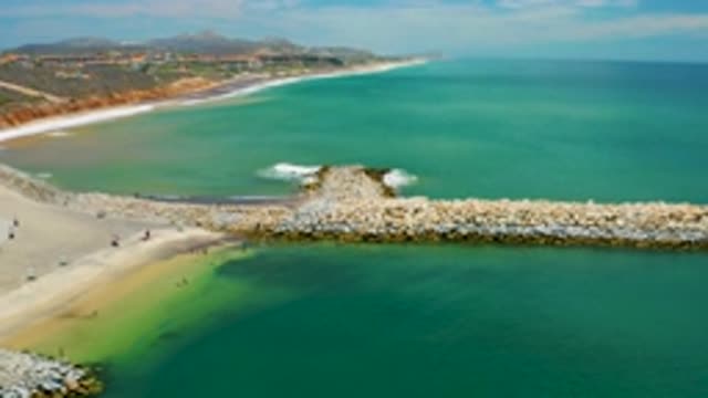 SAN JOSE DEL CABO MEXICO-2020: Panning Towards Coastline Wrapped Around Large