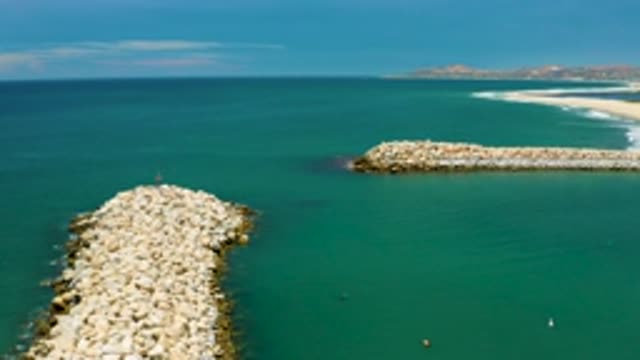 SAN JOSE DEL CABO MEXICO-2020: White Big Stones Arranged In The Green And Blue