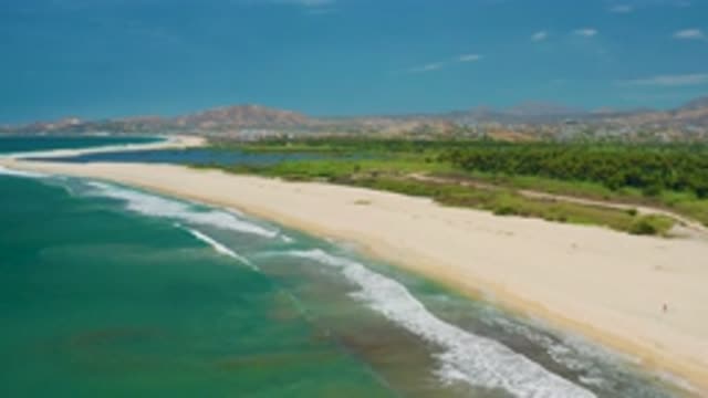SAN JOSE DEL CABO MEXICO-2020: Soaring Over The Beautiful Beaches While Gentle Waves Crash