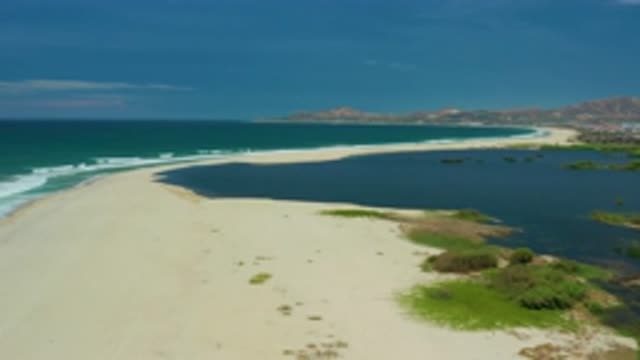 SAN JOSE DEL CABO MEXICO-2020: Drone Video Panning Over Beach At Tide With Turquoise Ocean