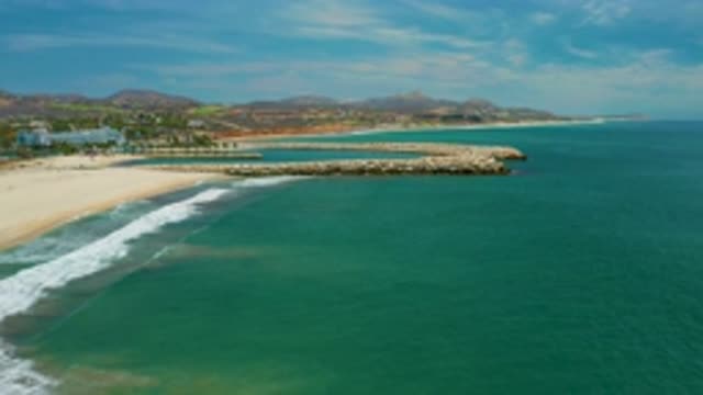 SAN JOSE DEL CABO MEXICO-2020: Green And Blue Seawater And Tall Trees Around